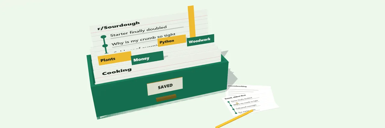 A green card-index drawer full of tabbed cards on a pale green desk. One card stands pulled up with a yellow ribbon through it.