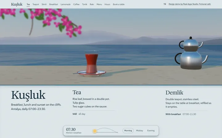 The café demo on a laptop: a glass of tea and a double teapot on a table above the sea, with the morning menu below.